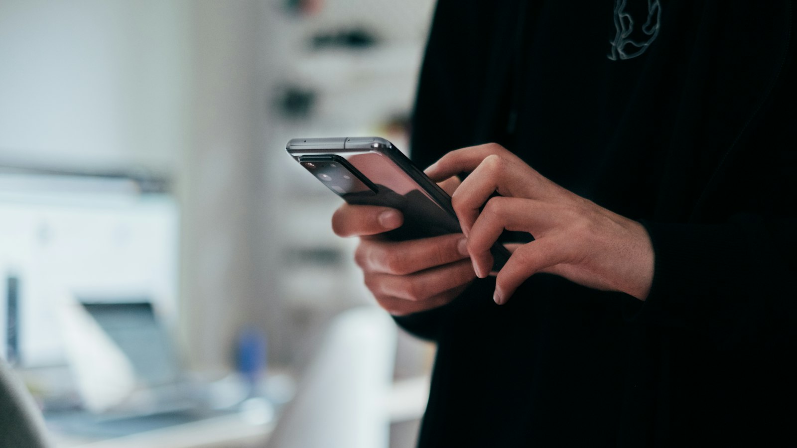 Person holding black android smartphone